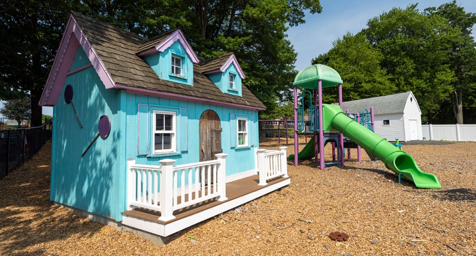 Playhouse and slide at Mother Hubbard Preschool