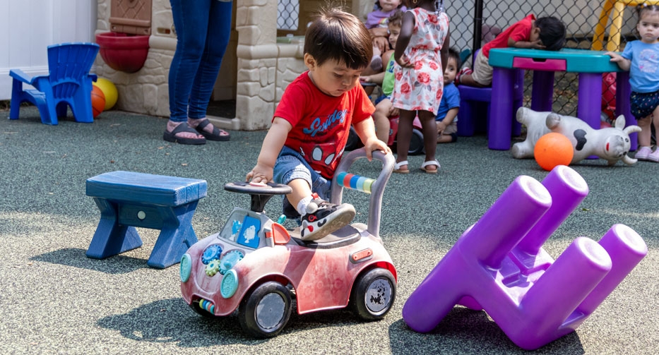 Riding around at Mother Hubbard Preschool