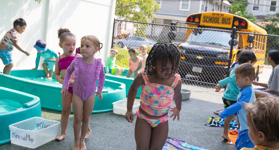 Little kids playing at the pools at Mother Hubbard Preschool